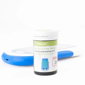 Vial Reddyz de tiras UA02 para ácido úrico en sangre, junto al equipo compatible